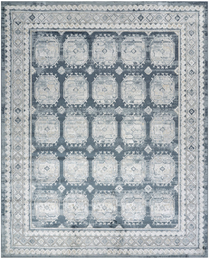 Blue-gray distressed area rug with a grid of pale octagonal medallions and ornate borders.