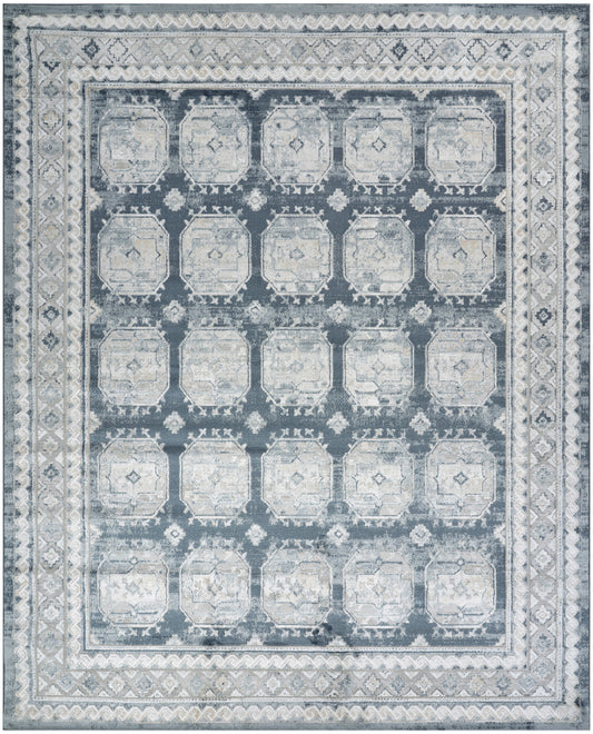 Blue-gray distressed area rug with a grid of pale octagonal medallions and ornate borders.