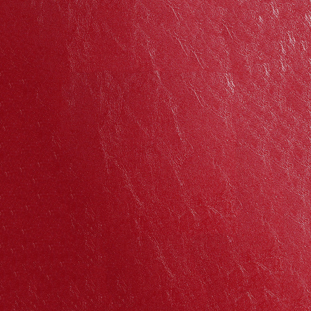 Close-up of red distressed fabric texture with natural grain.