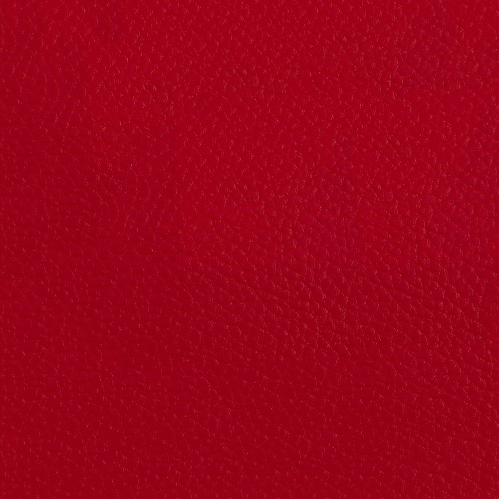 Crimson red solid fabric texture; close-up of woven textile material.