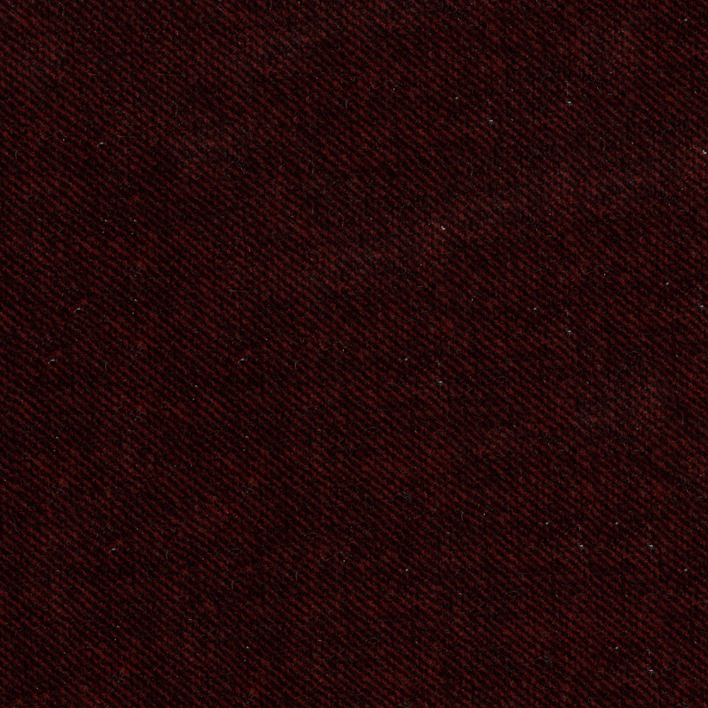 Close-up of dark burgundy twill fabric with a fine diagonal weave and rich textile texture.