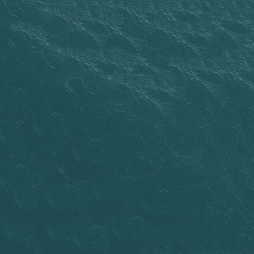 Aerial view of teal ocean water with subtle waves and white foam highlights.