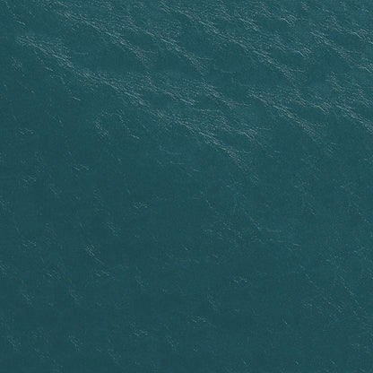 Aerial view of teal ocean water with subtle waves and white foam highlights.