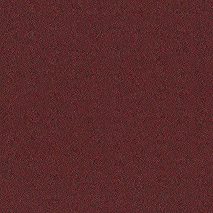 Close-up of dark burgundy leather texture with fine grain, suitable for upholstery or handbags.
