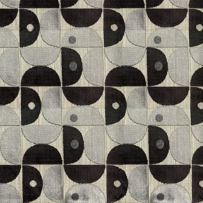 Grayscale woven fabric with repeating geometric pattern of black and gray semicircles forming motifs in a grid