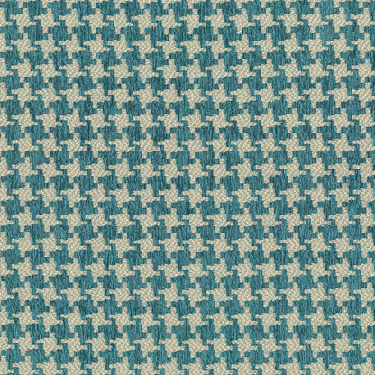 Close-up of teal & cream houndstooth woven fabric, classic geometric pattern for upholstery or apparel.