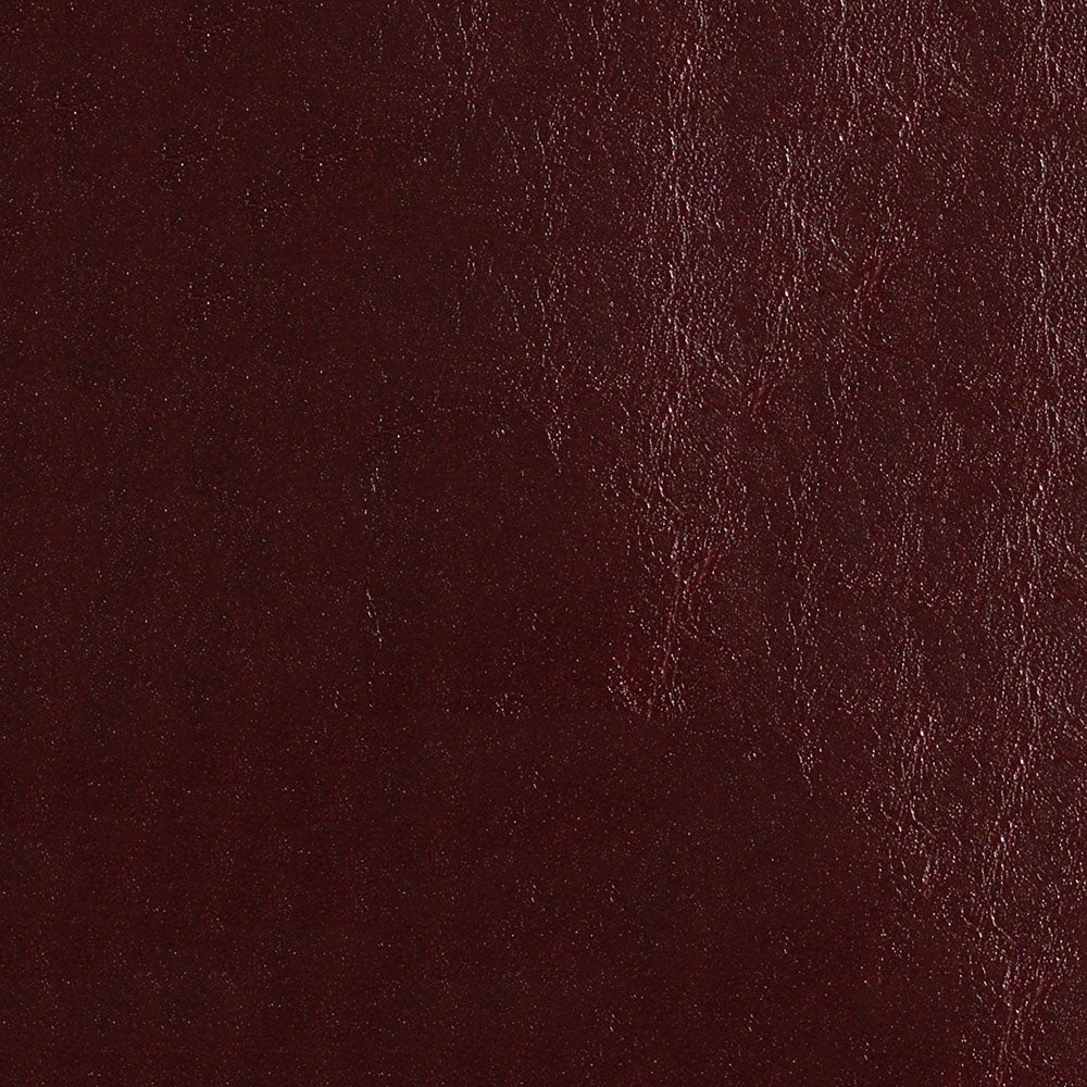 Dark burgundy leather texture close-up with natural grain and subtle sheen