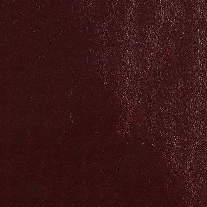 Dark burgundy leather texture close-up with natural grain and subtle sheen