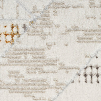 Cream woven rug with taupe geometric motif and brown accents; soft texture, modern tribal style.