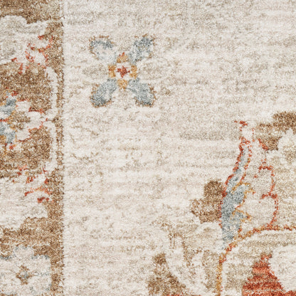 Beige floral area rug with cream background, brown border accents and blue and orange blossoms.
