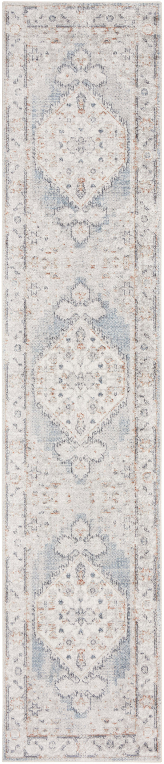 Long oriental-style runner rug in cream and dusty blue with repeating floral medallions and bordered edges.