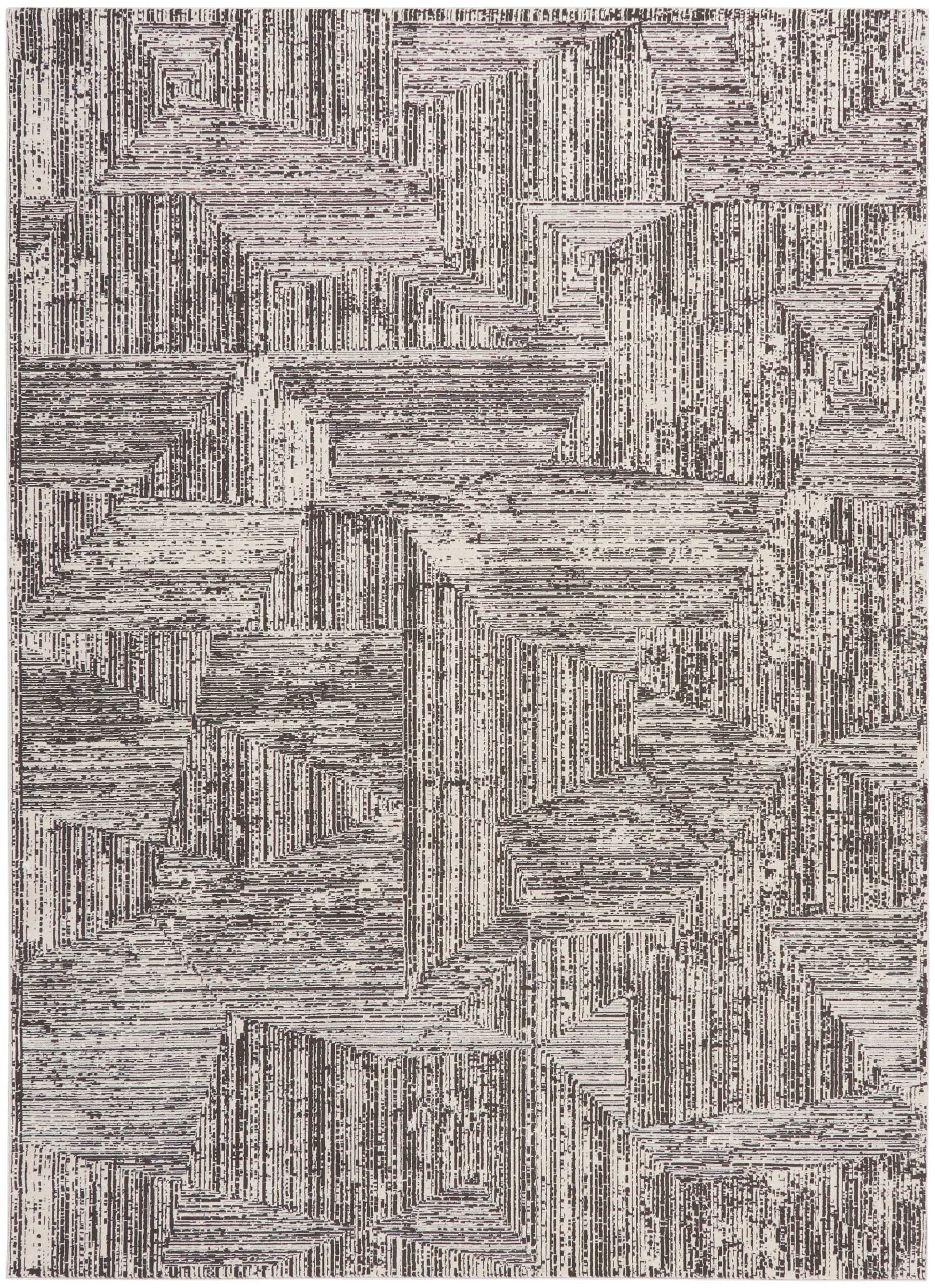 Abstract geometric area rug with cream and charcoal linear block patterns and textured stripes.