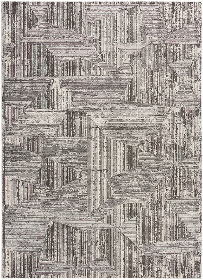 Abstract geometric area rug with cream and charcoal linear block patterns and textured stripes.
