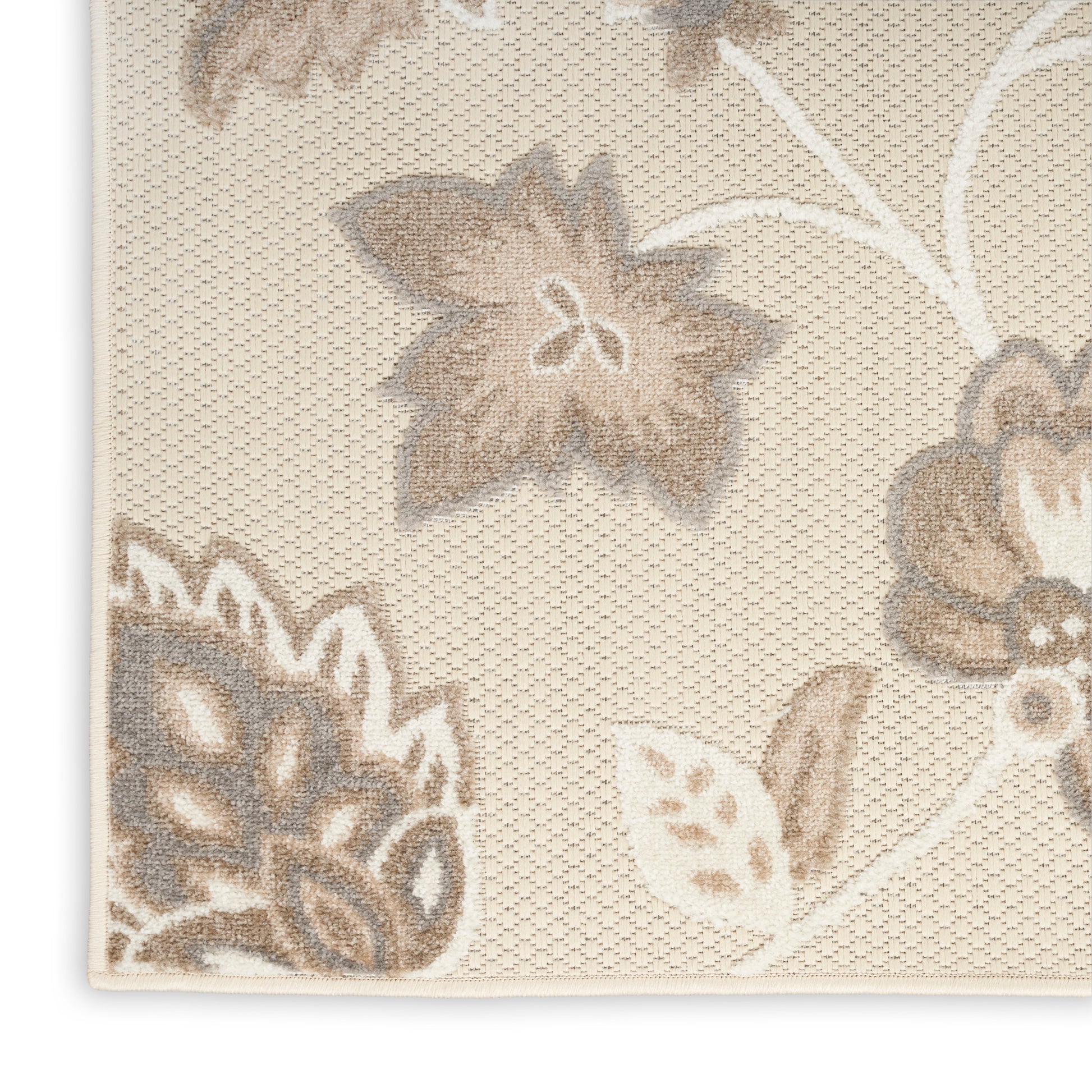 Cream-beige textured rug with taupe floral damask pattern; woven jacquard rug, corner view.
