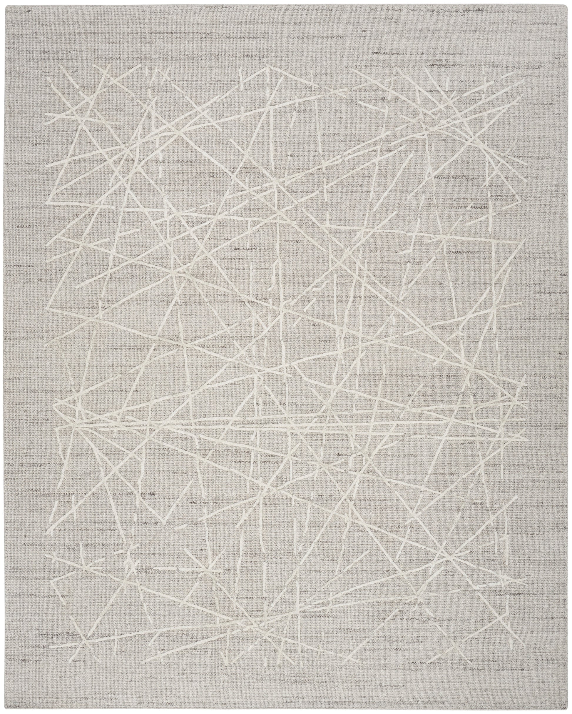 Light gray rug with white abstract scribble lines in a modern, contemporary design.