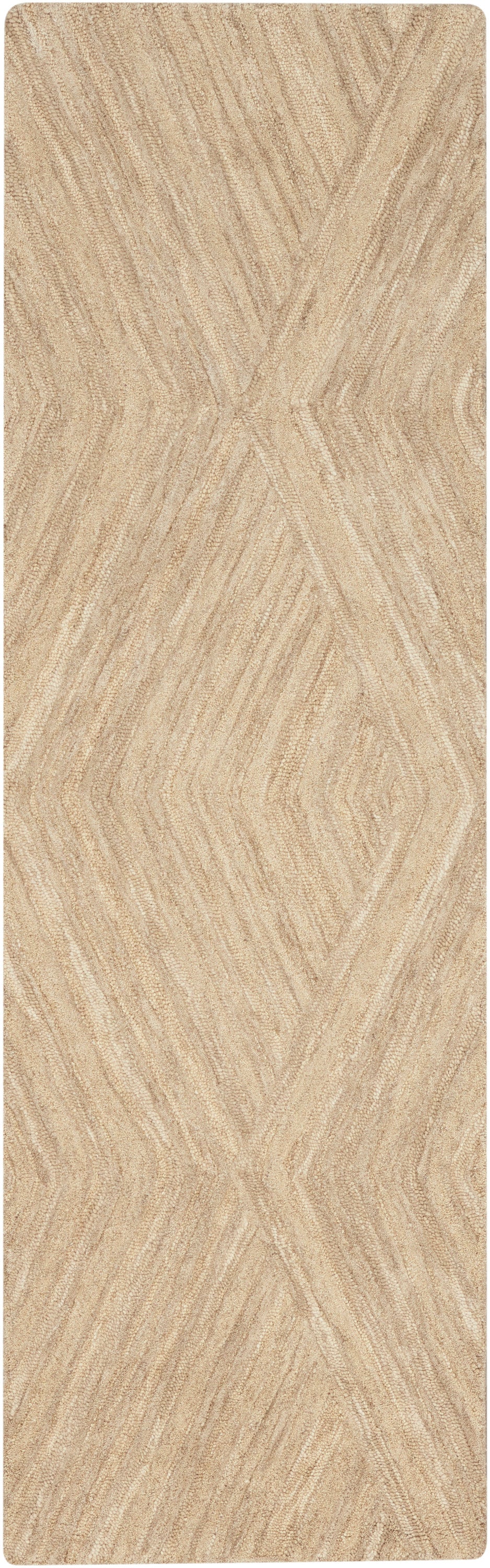 Beige runner rug with raised chevron geometric pattern and soft textured pile.