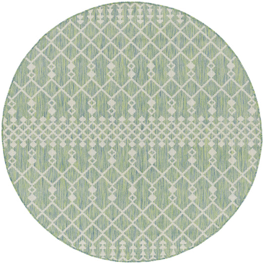 Round mint green rug with a white geometric lattice pattern and a horizontal center band.