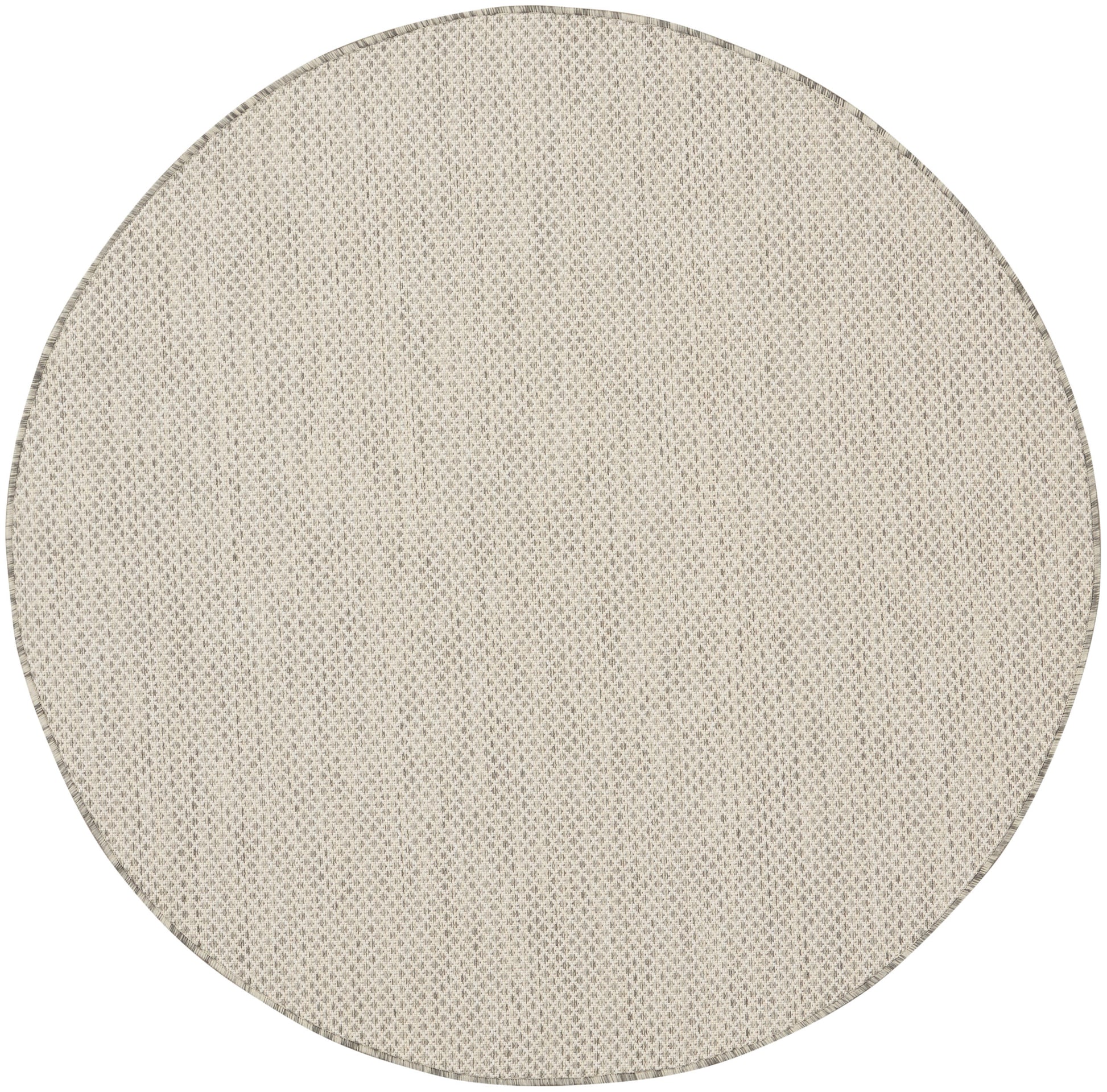 Beige round woven rug with subtle diamond texture; natural, casual home decor.