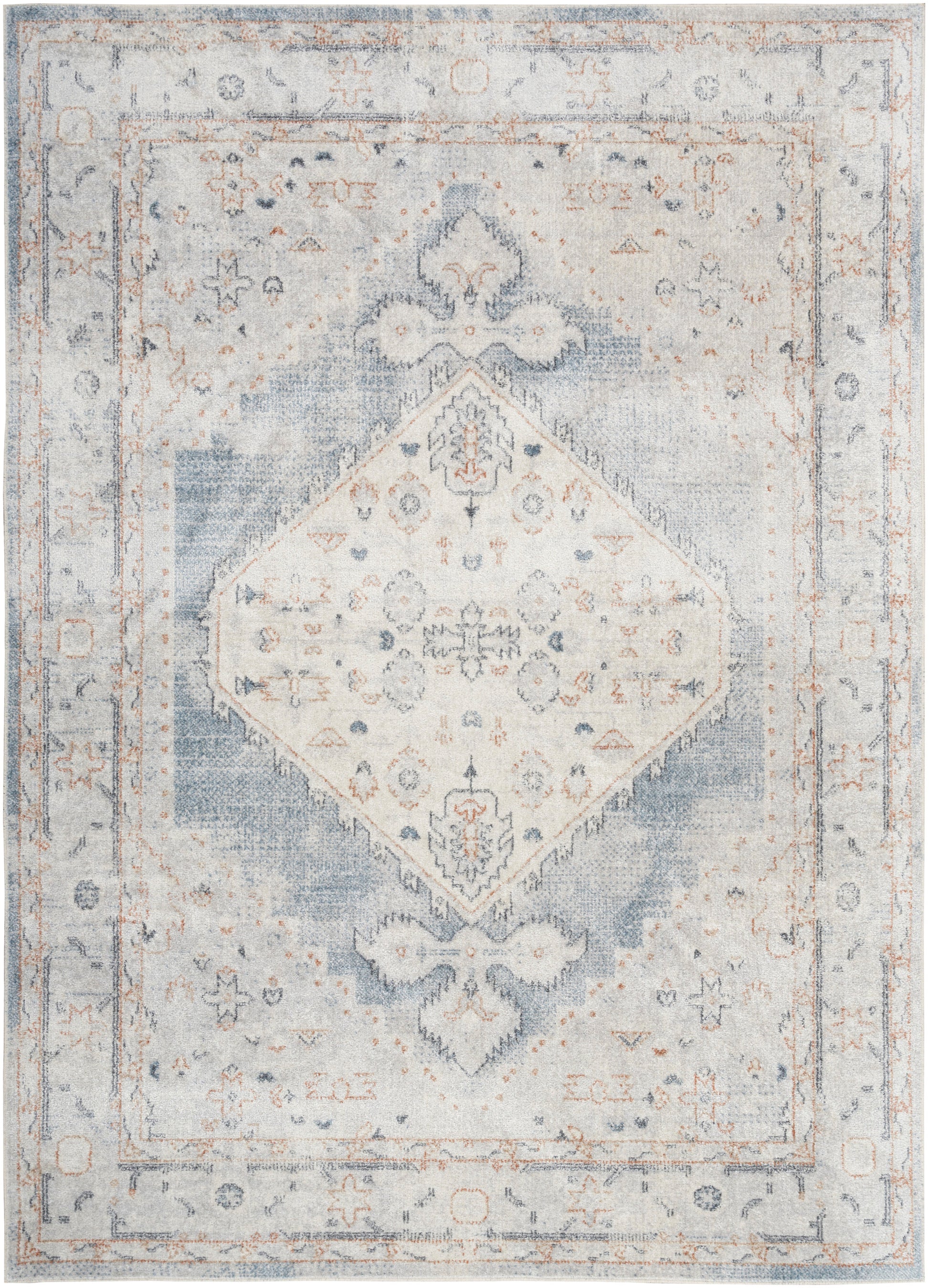 Distressed vintage-style oriental rug in soft blue and ivory with a diamond medallion and faded floral border.