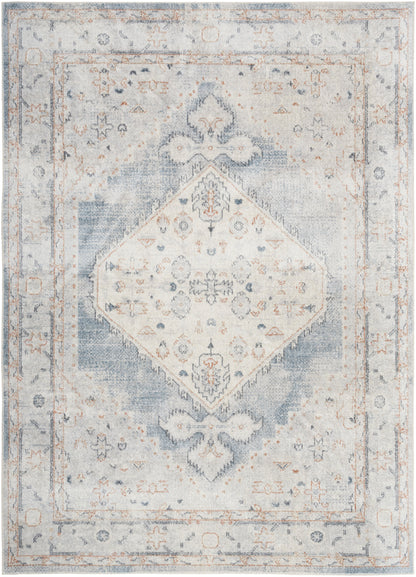 Distressed vintage-style oriental rug in soft blue and ivory with a diamond medallion and faded floral border.