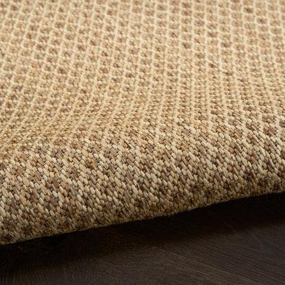 Natural beige jute rug, rectangular flat weave with rolled edge, rustic coastal decor for living spaces.