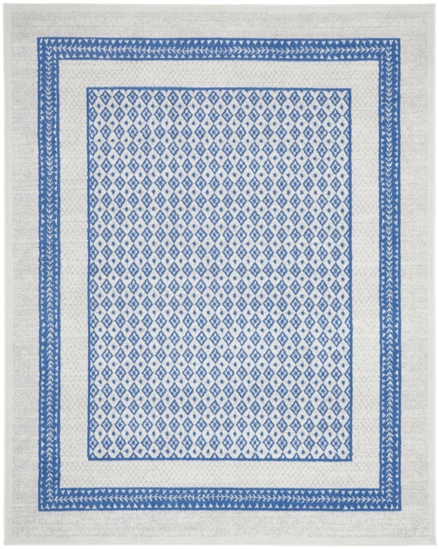 Blue and white geometric rug with dense diamond pattern framed by layered blue borders on a light cream field