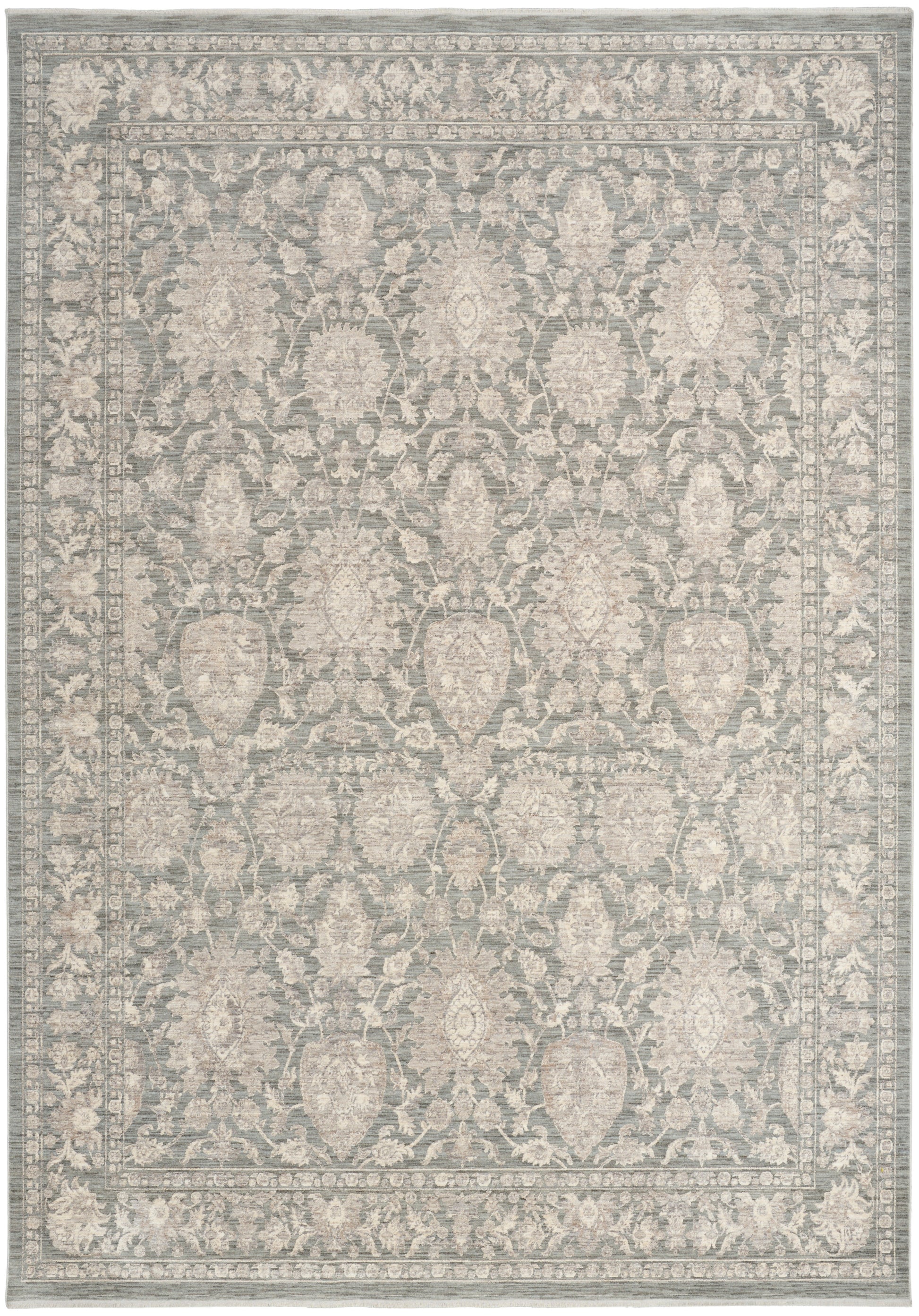 Rectangular area rug in blue-gray with ivory damask floral pattern and ornate border; traditional decor.
