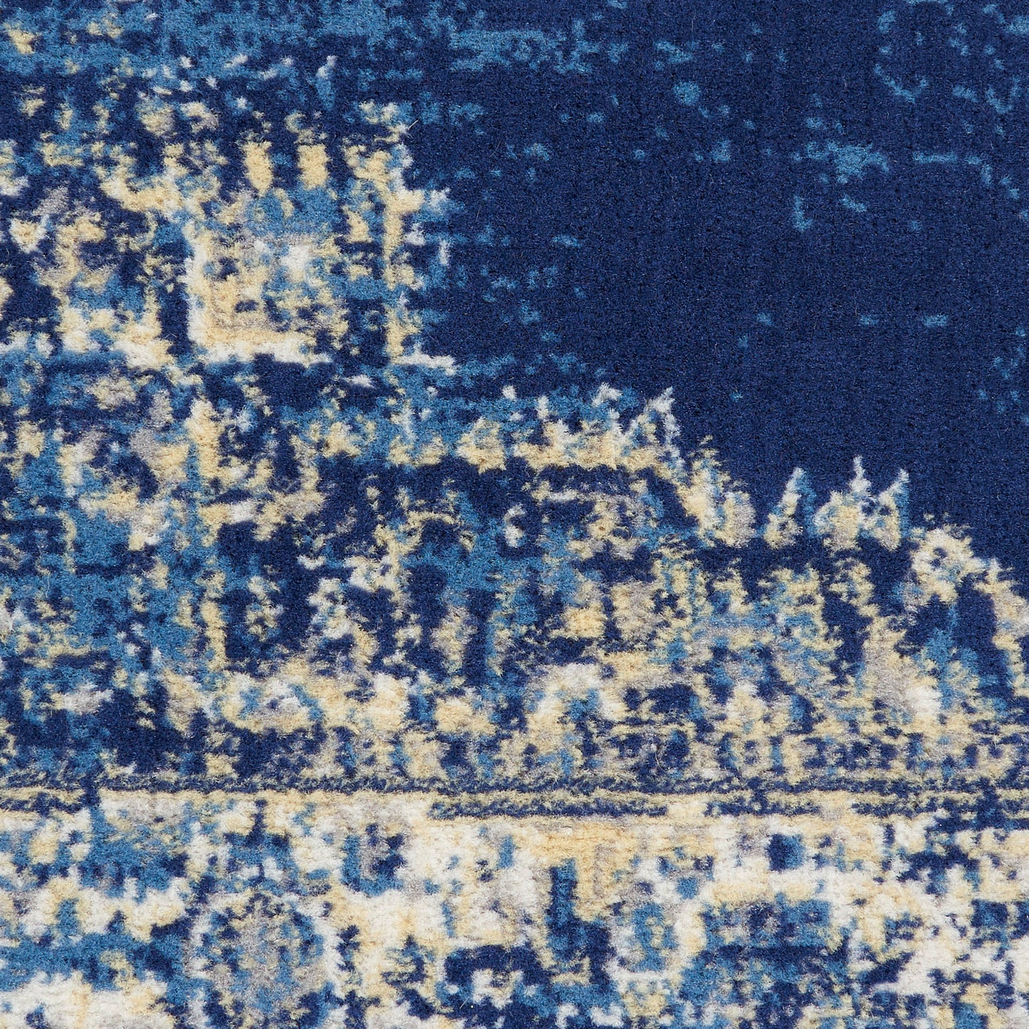 Blue abstract patterned rug with cream and beige highlights, modern textured design for living room decor