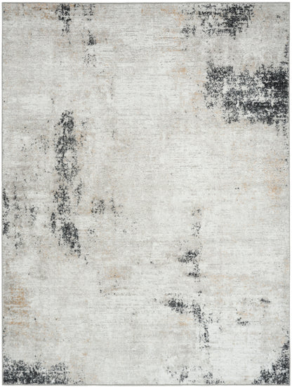 Rectangular area rug with abstract distressed pattern in cream, light gray and charcoal; modern, versatile decor.