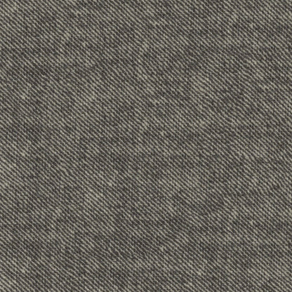 Close-up of grey denim fabric with diagonal twill weave and subtle mottled texture.