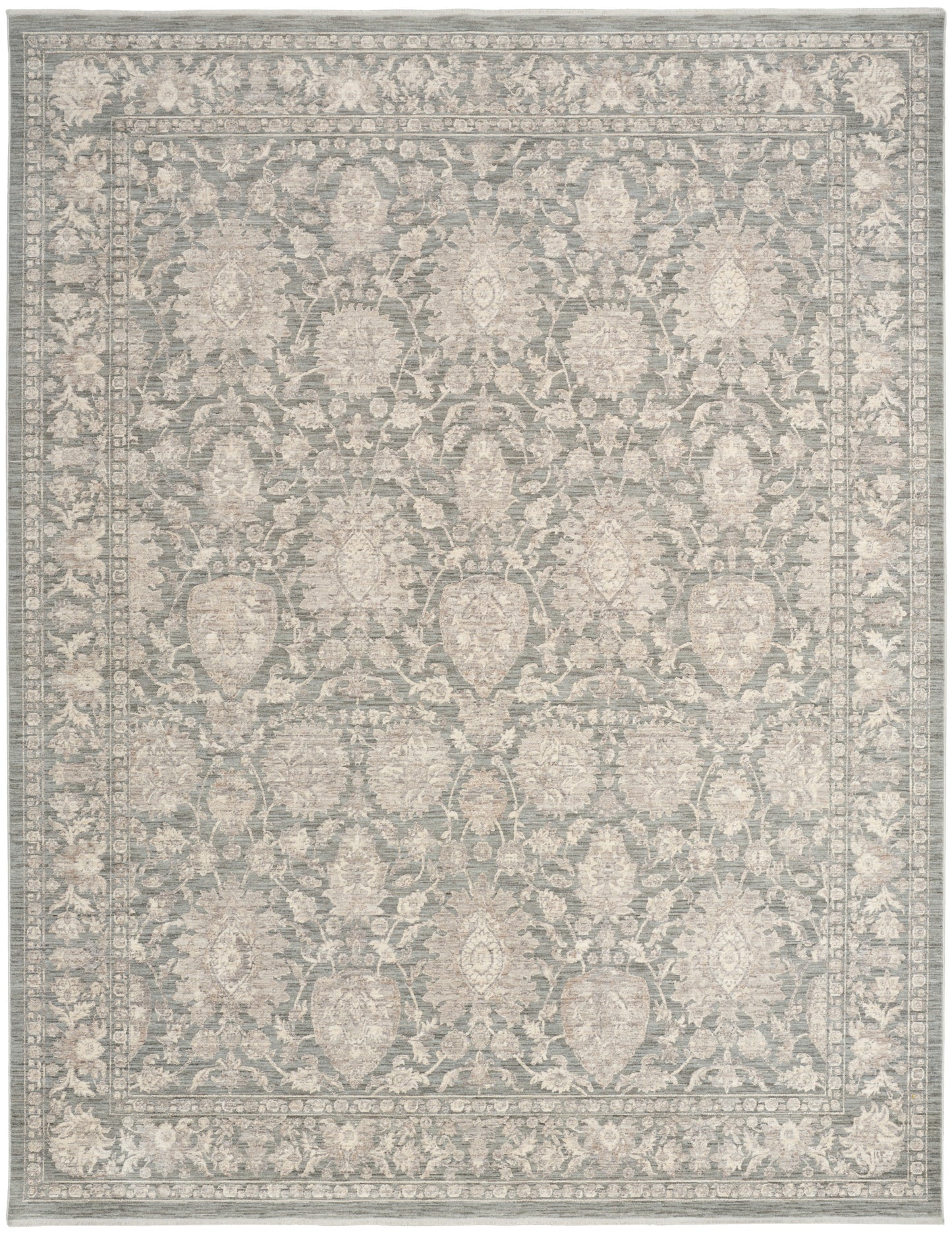 Gray-blue oriental area rug with ivory floral medallions and a decorative border; traditional design.