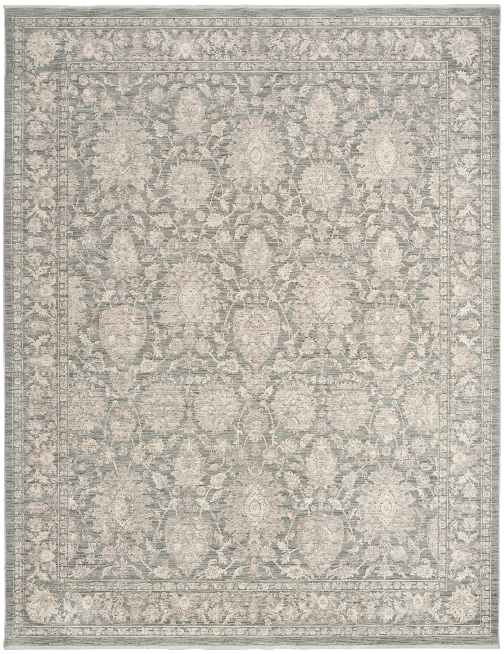 Gray-blue oriental area rug with ivory floral medallions and a decorative border; traditional design.