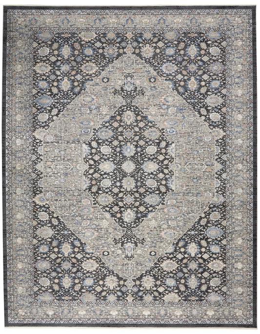 Persian-inspired oriental rug with a navy field, ivory and light blue floral medallion center, framed by intricate borders.