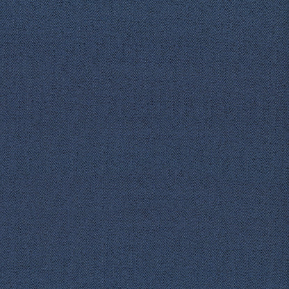 Indigo herringbone fabric close-up with subtle texture.