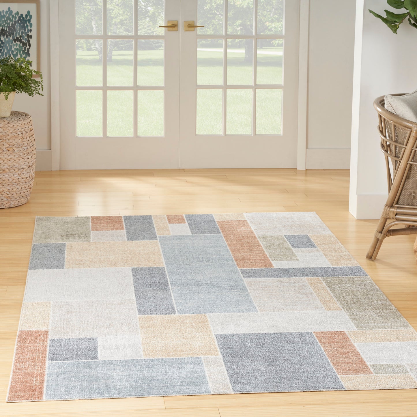 4' x 6' contemporary multicolor area rug with an abstract pattern; polyester flat weave, easy-clean indoor rug for living room or bedroom.