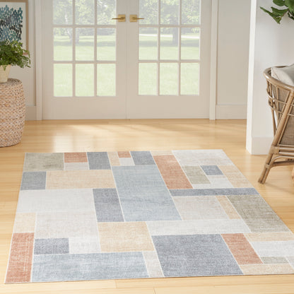 4' x 6' contemporary multicolor area rug with an abstract pattern; polyester flat weave, easy-clean indoor rug for living room or bedroom.