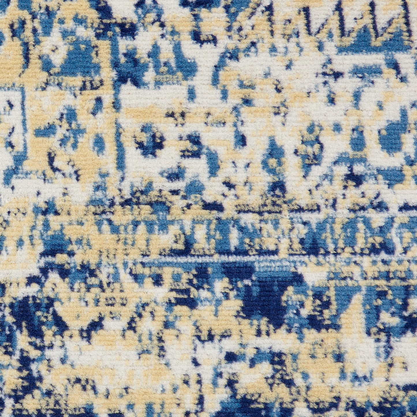 Abstract blue and beige distressed area rug with geometric pattern; plush pile, vintage style.