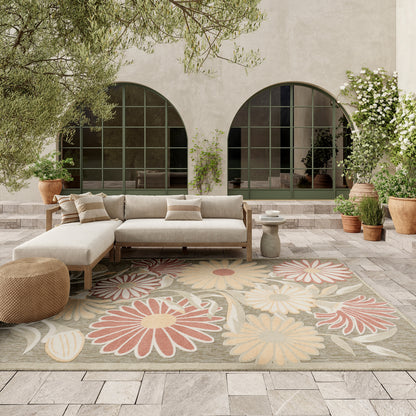 Outdoor beige rug with floral pattern beneath arched windows, 8' x 11'.