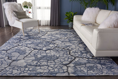 Nourison Home Divine Collection Mist 10’ x 14’ hand-knotted area rug in shimmering misty blue tones, crafted from fine wool and Luxcelle fibers with abstract design for luxury living room interiors.