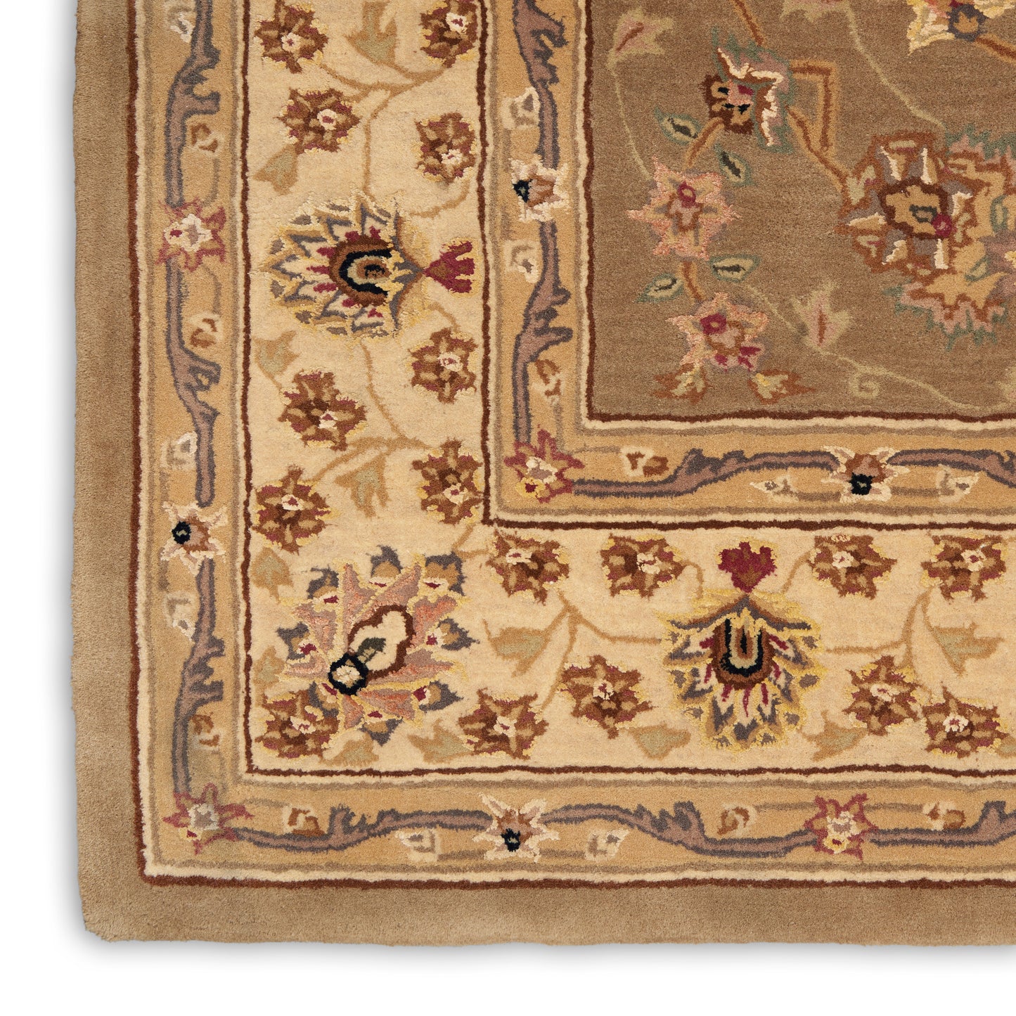 Close-up of an ornate oriental rug edge with beige and ivory borders and floral motifs in brown, blue, and red.