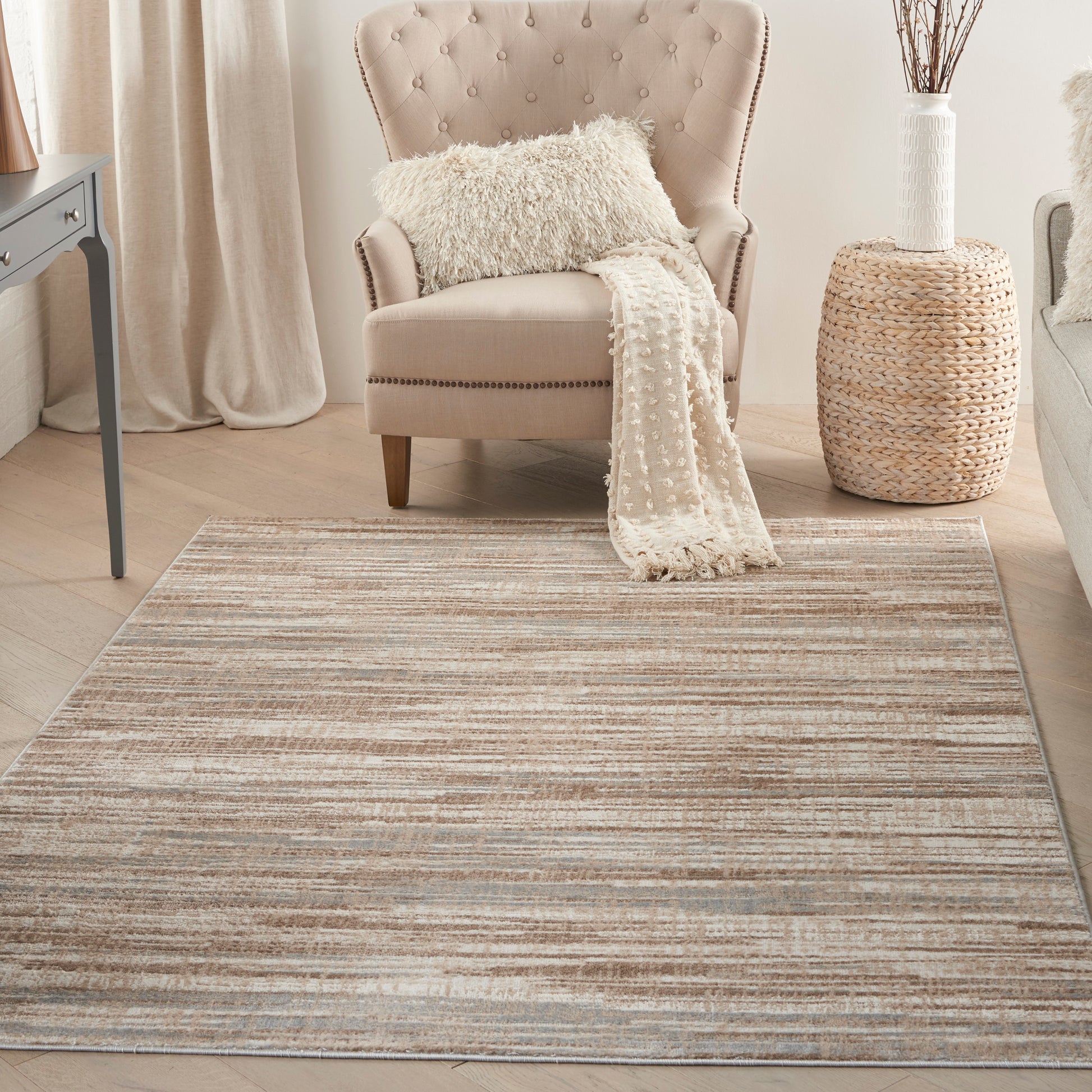 Beige modern rug with a striped neutral pattern, size 6' x 9'.
