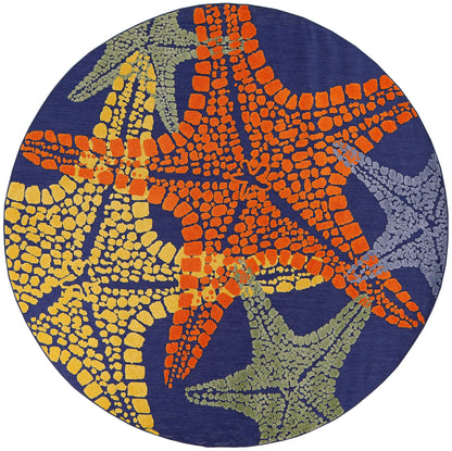 Round navy rug with orange, yellow, olive and gray mosaic starfish patterns; coastal woven style.