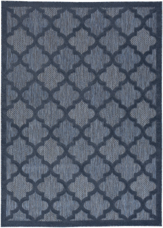 Blue geometric lattice rug with dark navy trellis pattern on light blue background; rectangular, woven, contemporary style.