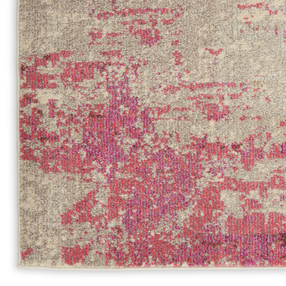 Beige woven rug with pink and magenta abstract blotches; rectangular area rug for living room decor.