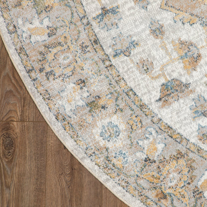 Round vintage floral area rug in ivory with blue and mustard accents on wood floor.