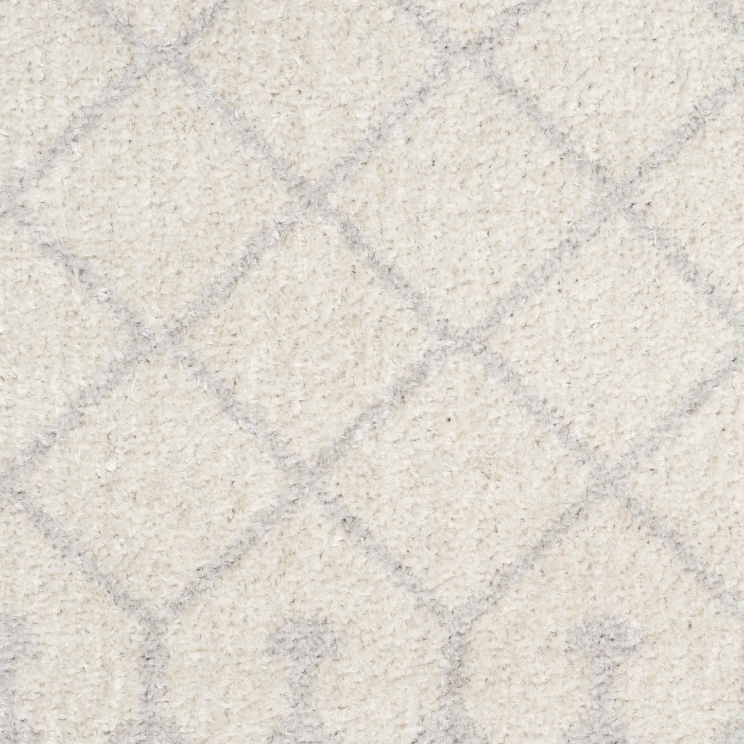Ivory plush rug with light gray diamond lattice and arched motif pattern.