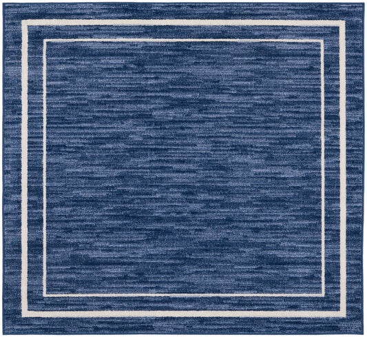 Square navy blue area rug with a white double border framing, plush textured surface, 5' x 5'.