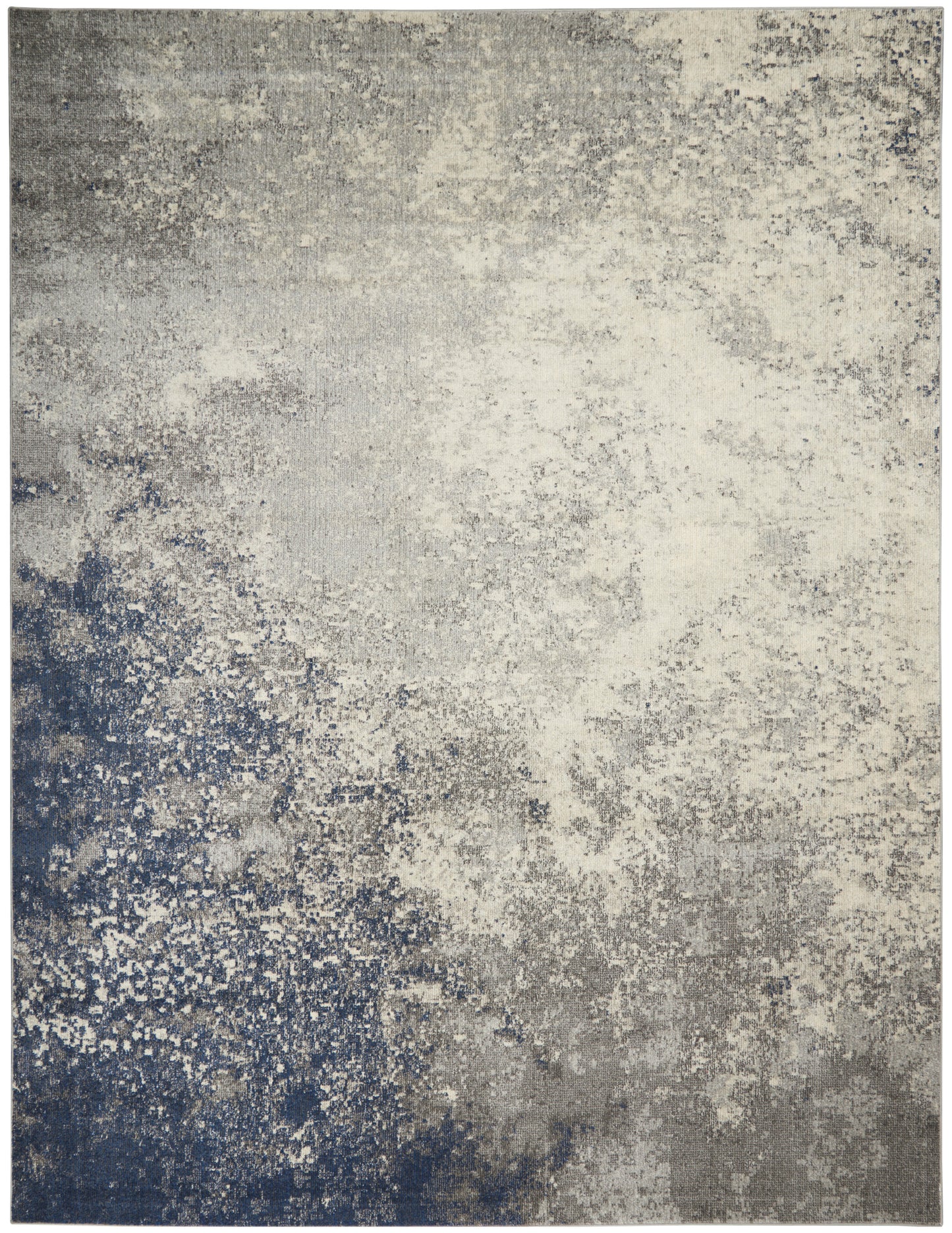 Abstract distressed area rug in blue-gray and ivory with a mottled, speckled pattern.