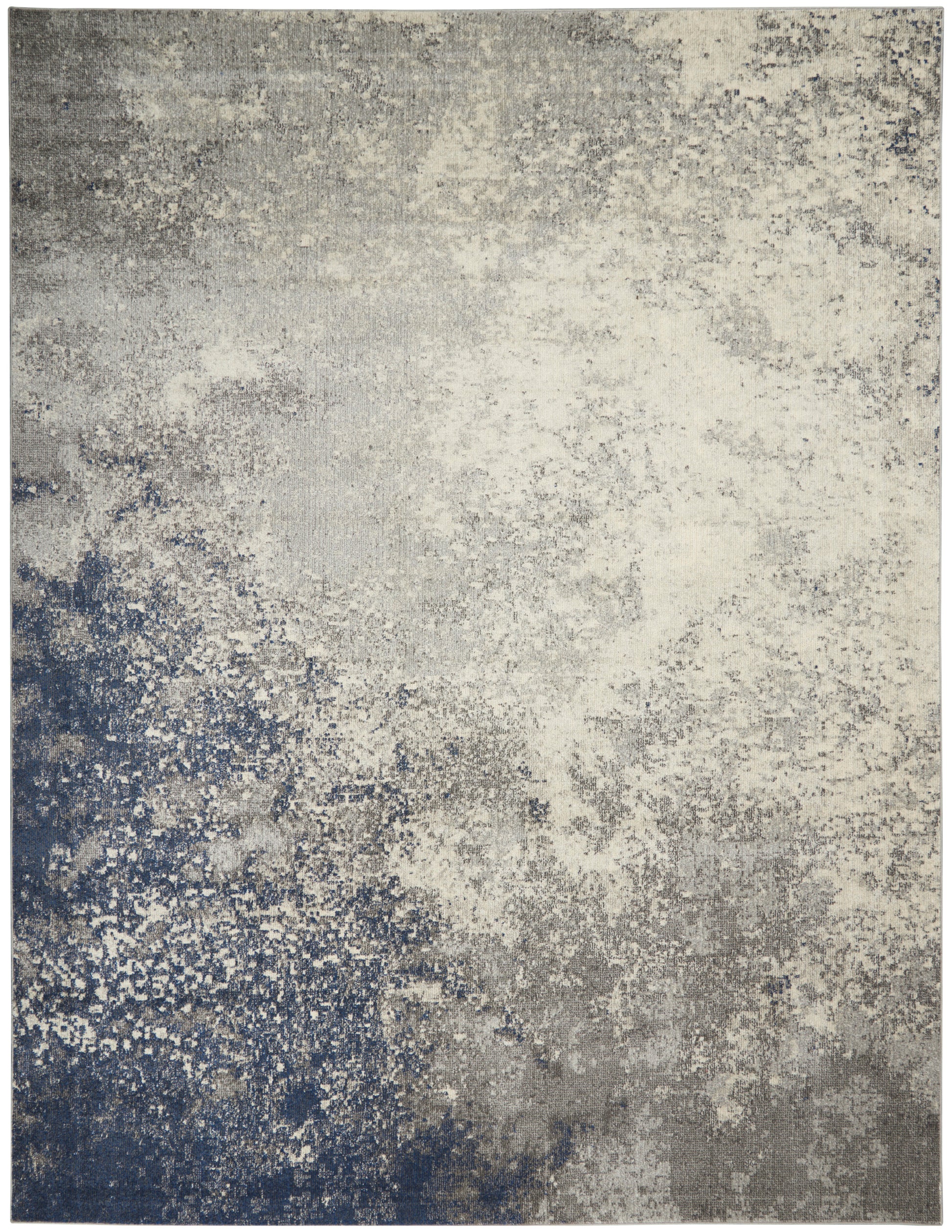 Abstract distressed area rug in blue-gray and ivory with a mottled, speckled pattern.