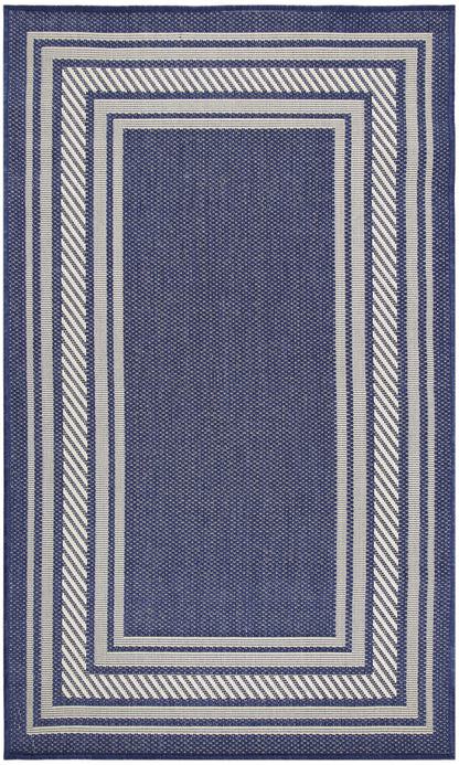 Indigo blue woven area rug with ivory stripes and layered rectangular borders in a geometric frame pattern.